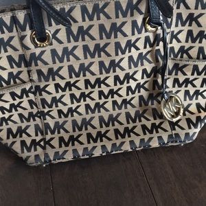 Michael Kors Tan and black handbag with MK logo